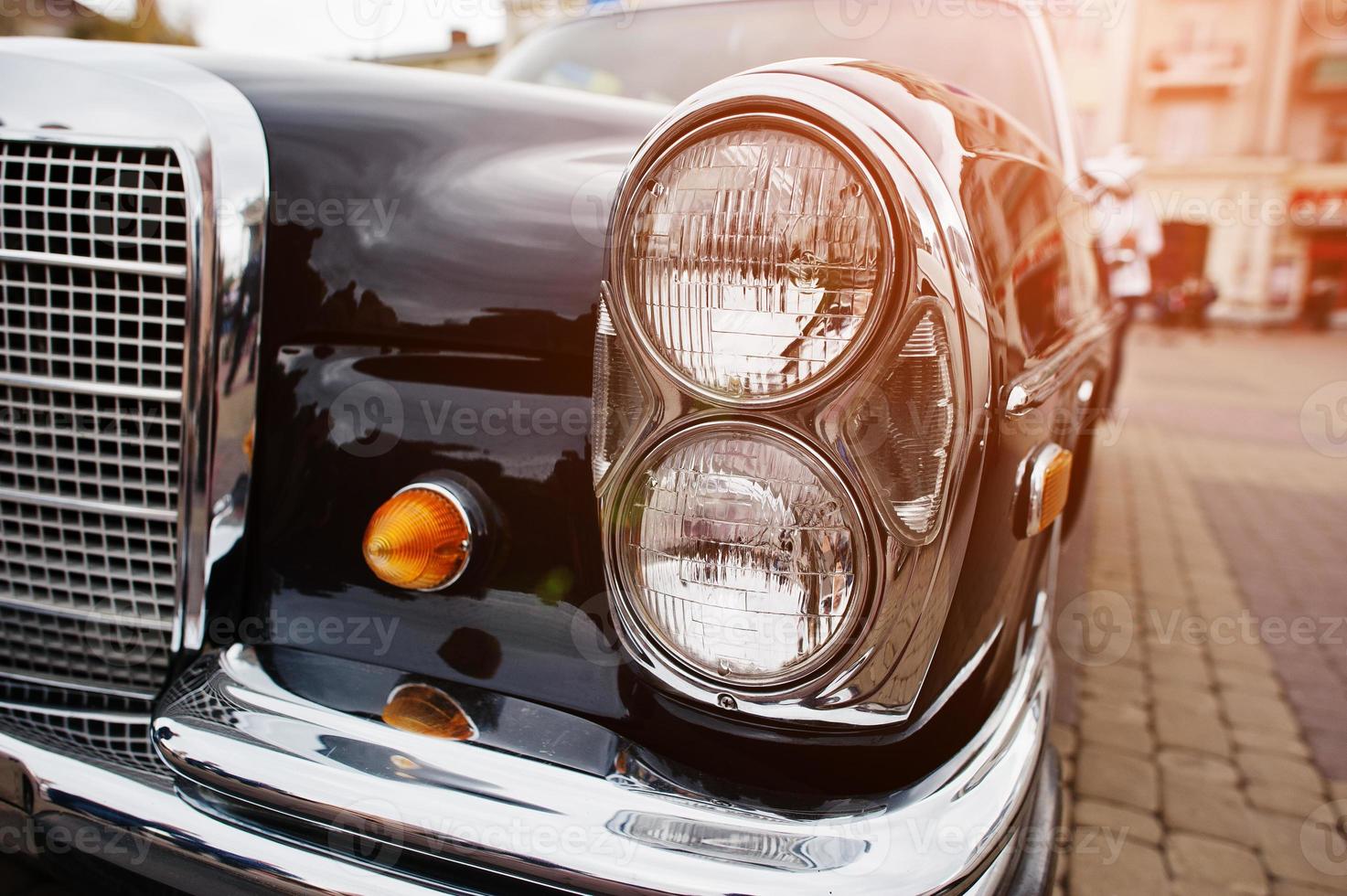 Retro car headlight. Front of old vintage car photo
