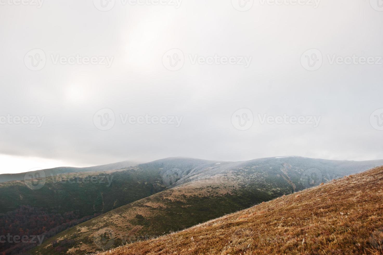 Great hills with snow covered at frozen morning on Carpathian mountains photo