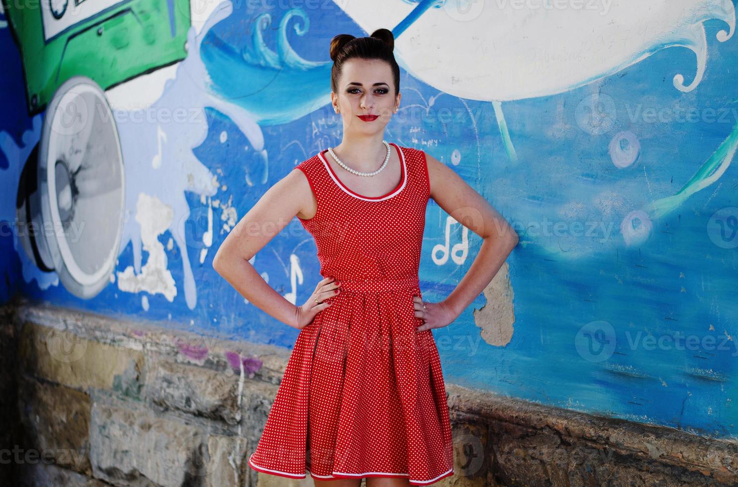Young pinup girl wearing at retro vintage old-fashioned dress in peas, retro styling. photo