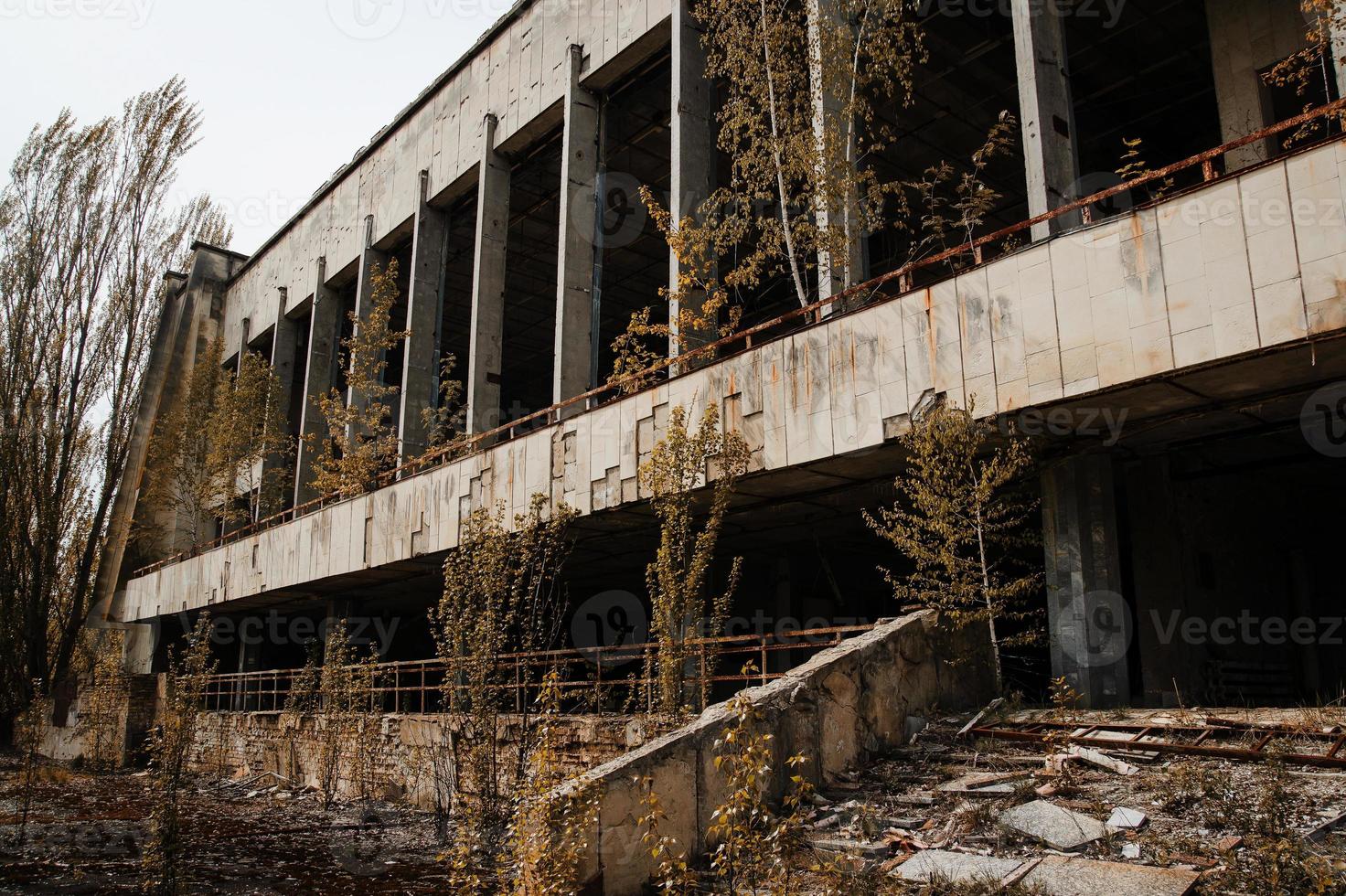 Chernobyl exclusion zone with ruins of abandoned pripyat city zone of radioactivity ghost town. photo