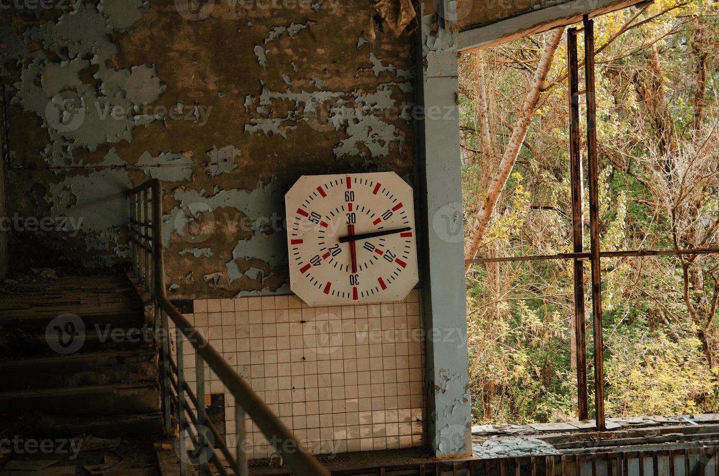 Lost school sport gym at Chernobyl city zone of radioactivity ghost town. photo