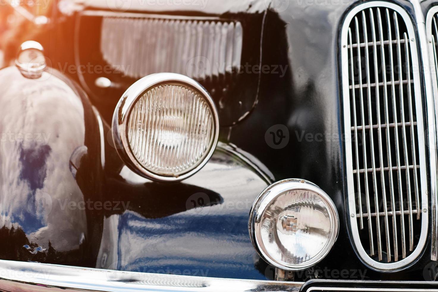 Retro car headlight. Front of old vintage car photo