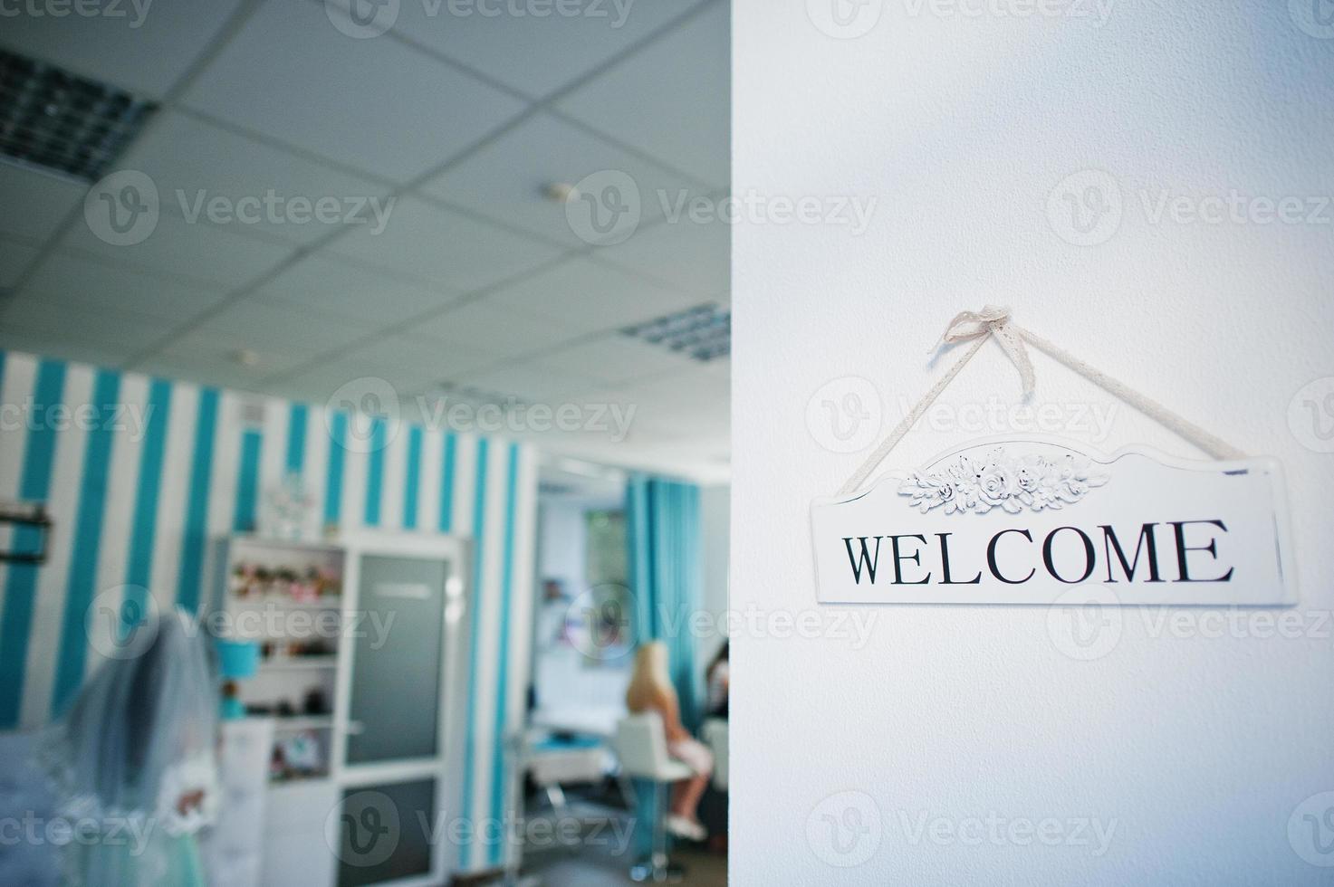 Wooden welcome sign blue beauty salon background photo