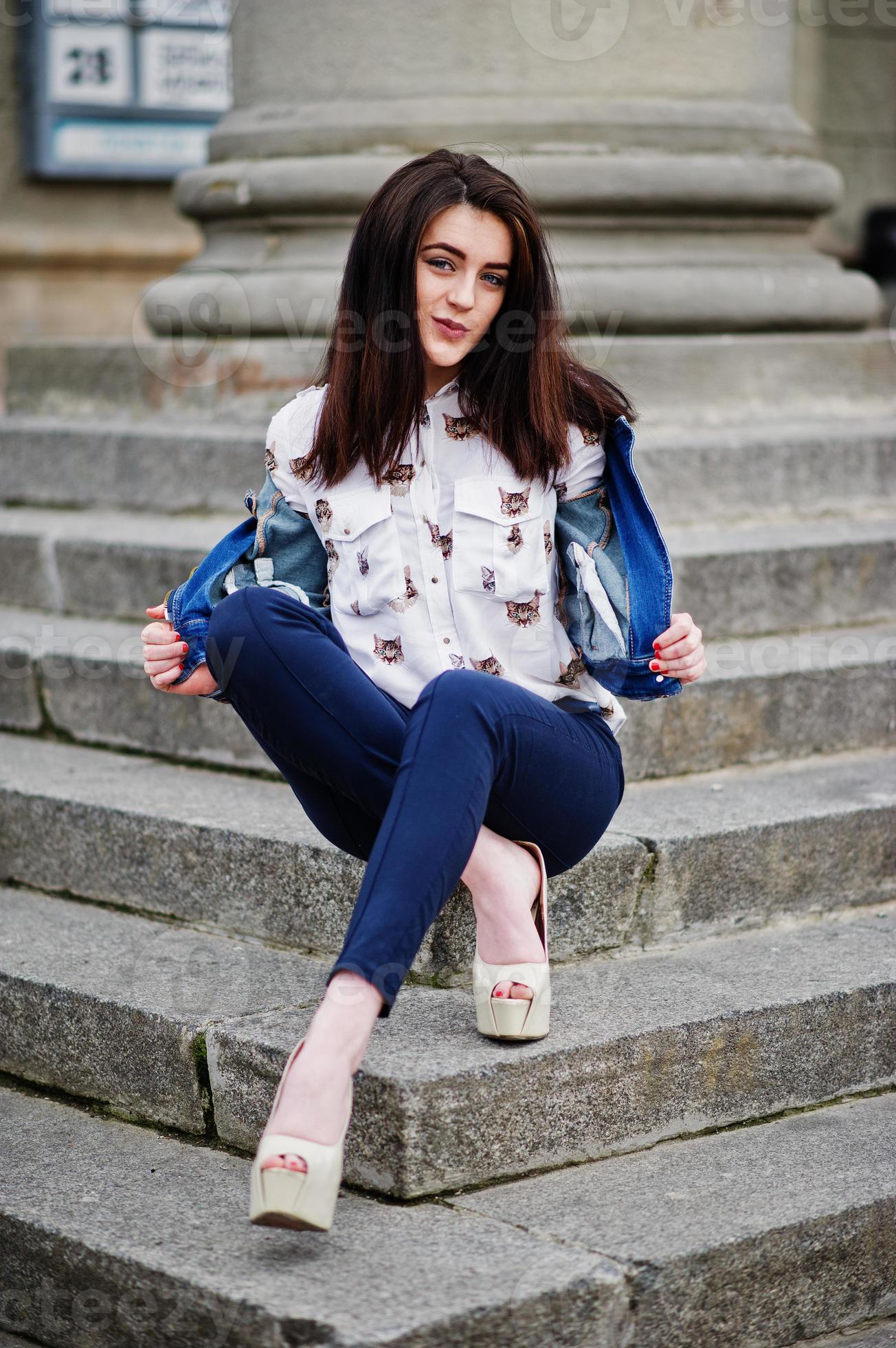 Young stylish brunette girl on shirt, pants, jeans jacket and high heels  shoes, posed at stone stairs. Street fashion model concept. 6633862 Stock  Photo at Vecteezy