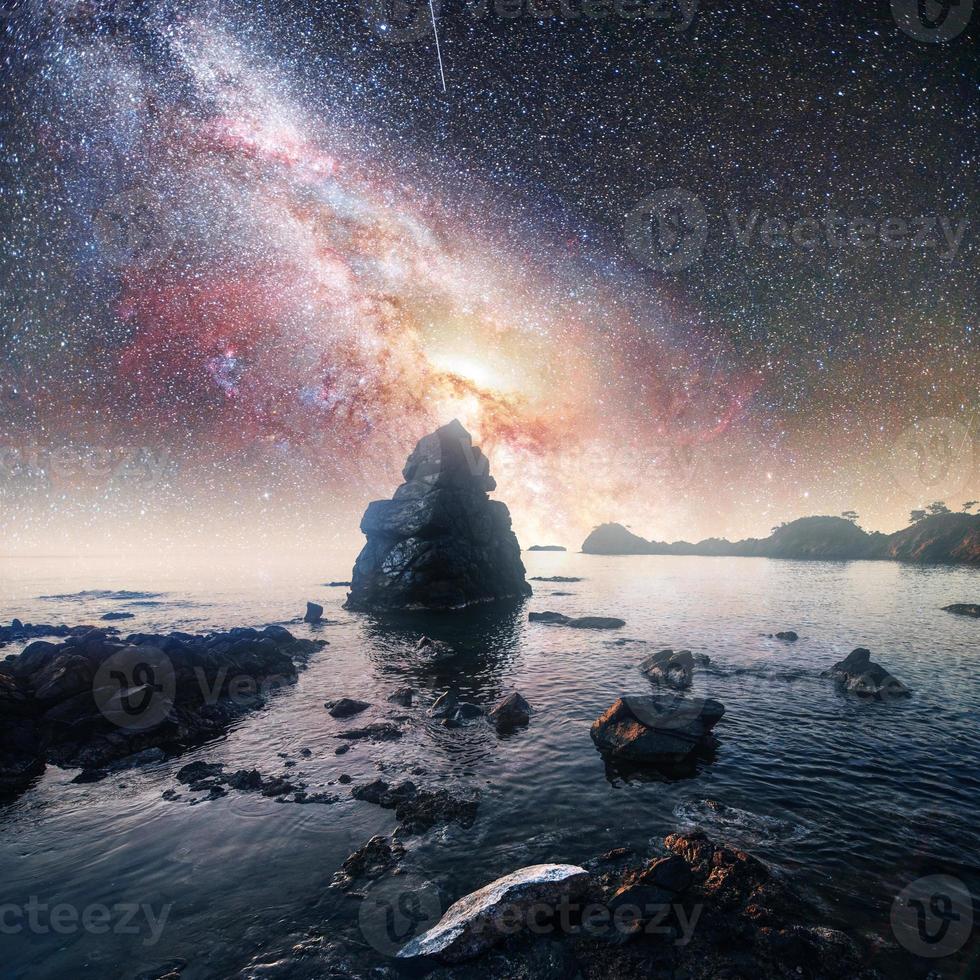 Fantastic starry sky and majestic mountains in the mist. Dramatic  beautiful morning. Autumn landscape. Courtesy of NASA photo