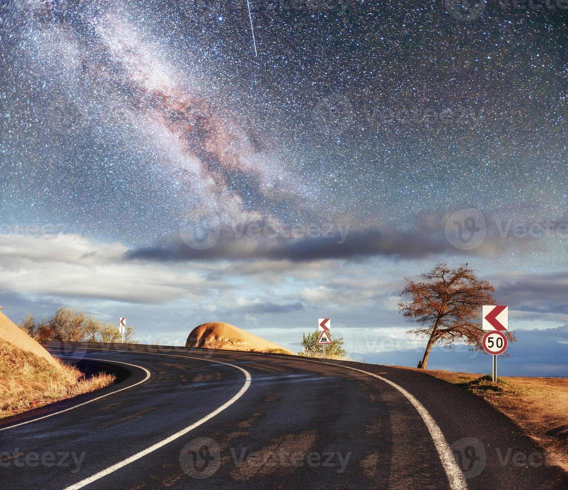 Fantastic starry sky and majestic mountains in the mist. Dramatic  beautiful morning. Autumn landscape. Courtesy of NASA photo