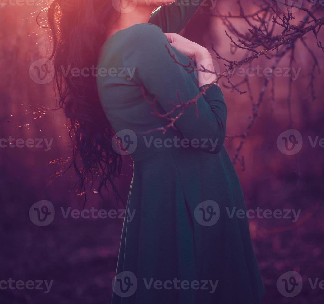 Evening portrait of young girl at sunset photo