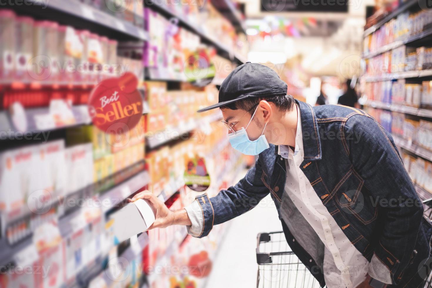 Asian men buy and shopping food  for hoarding in during the Covid outbreak photo