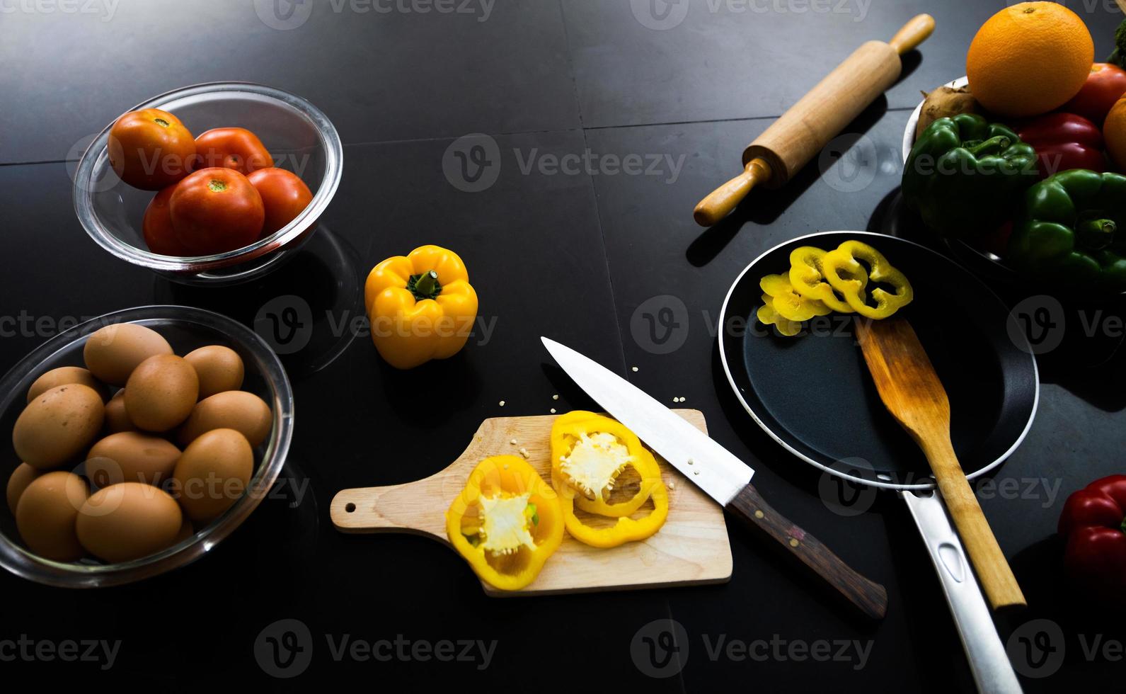 Food and fresh vegetables and salad bowls on kitchen table on top view .Healthy eating concept photo