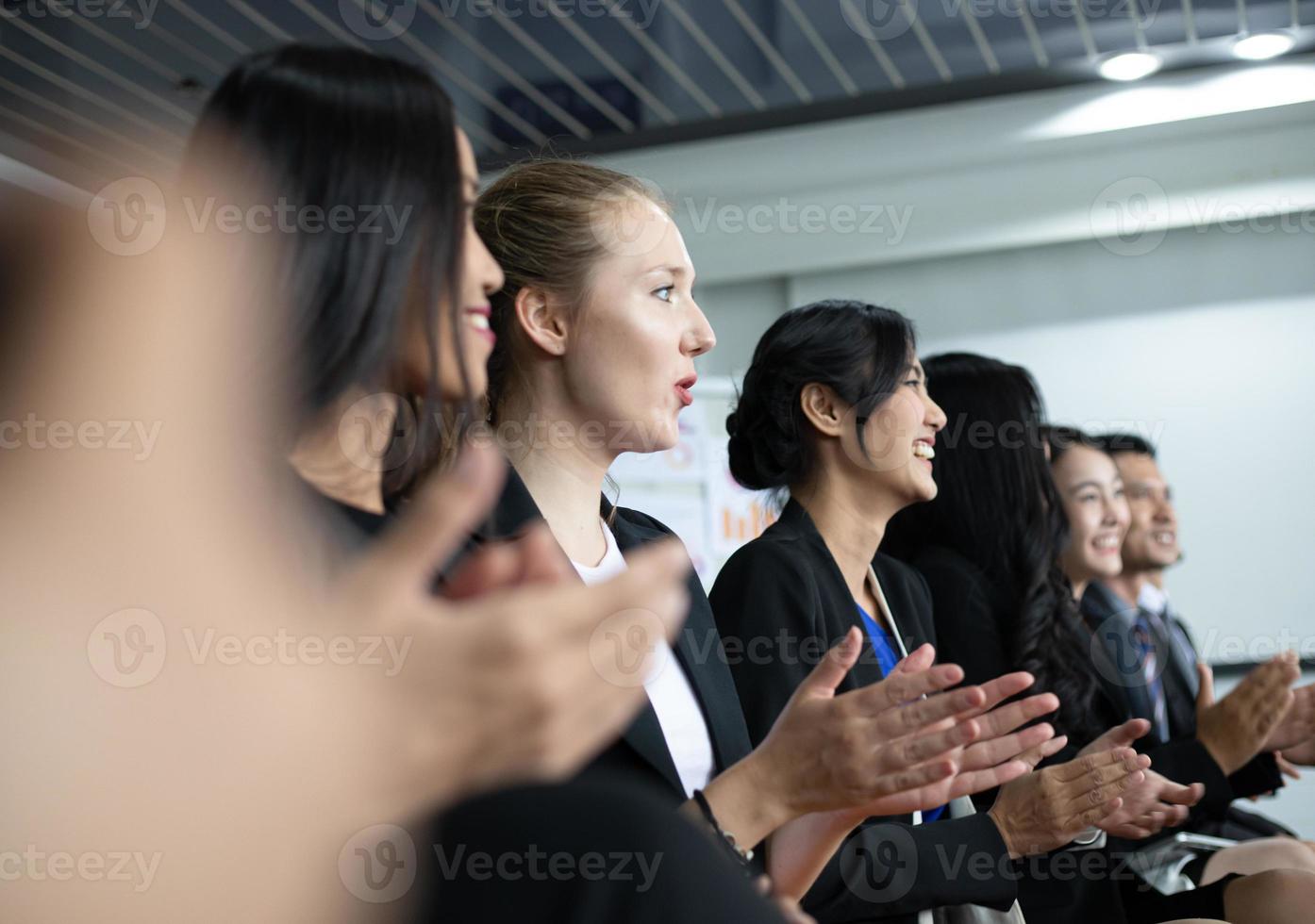 Business people executives applauding in  business meeting photo