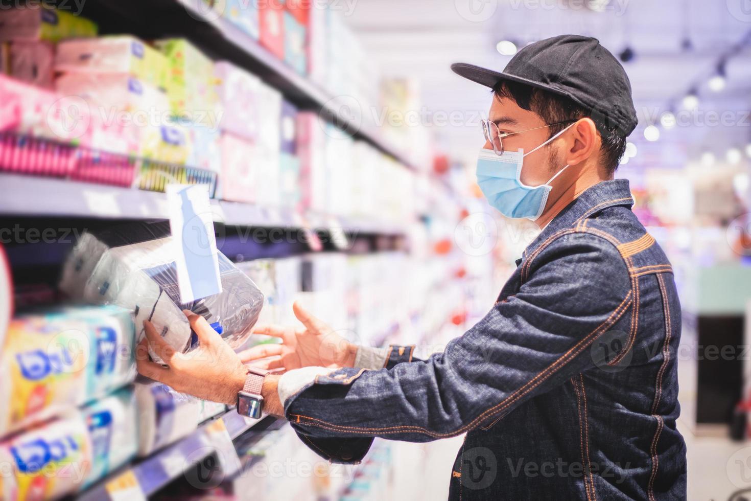 Asian men buy and shopping food  for hoarding in during the Covid outbreak photo