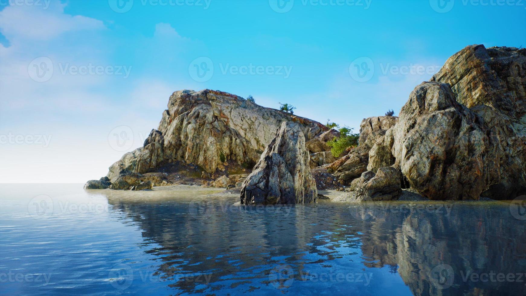 rocky tropical island in ocean photo