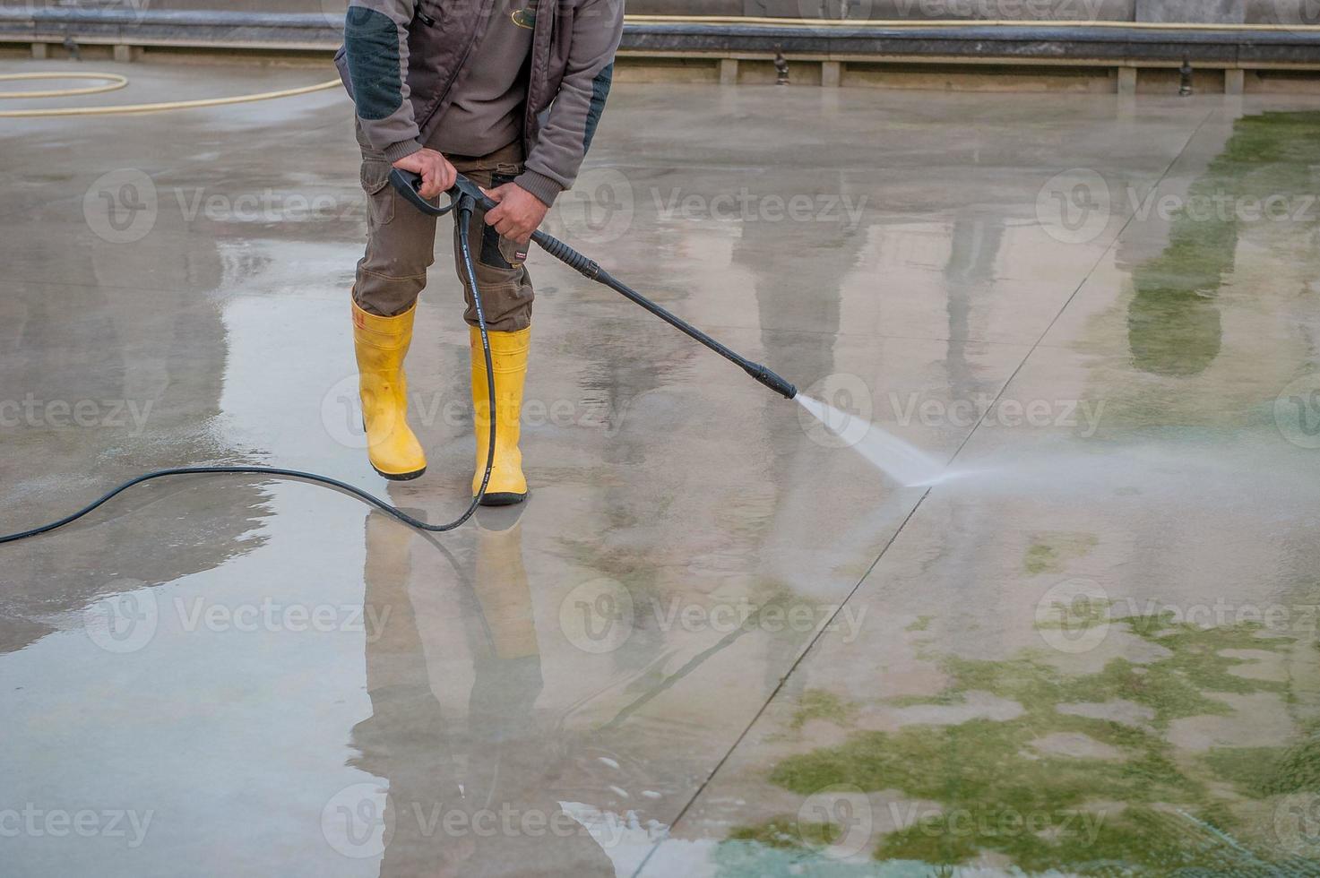 Worker assigned to the cleaning of urban areas photo