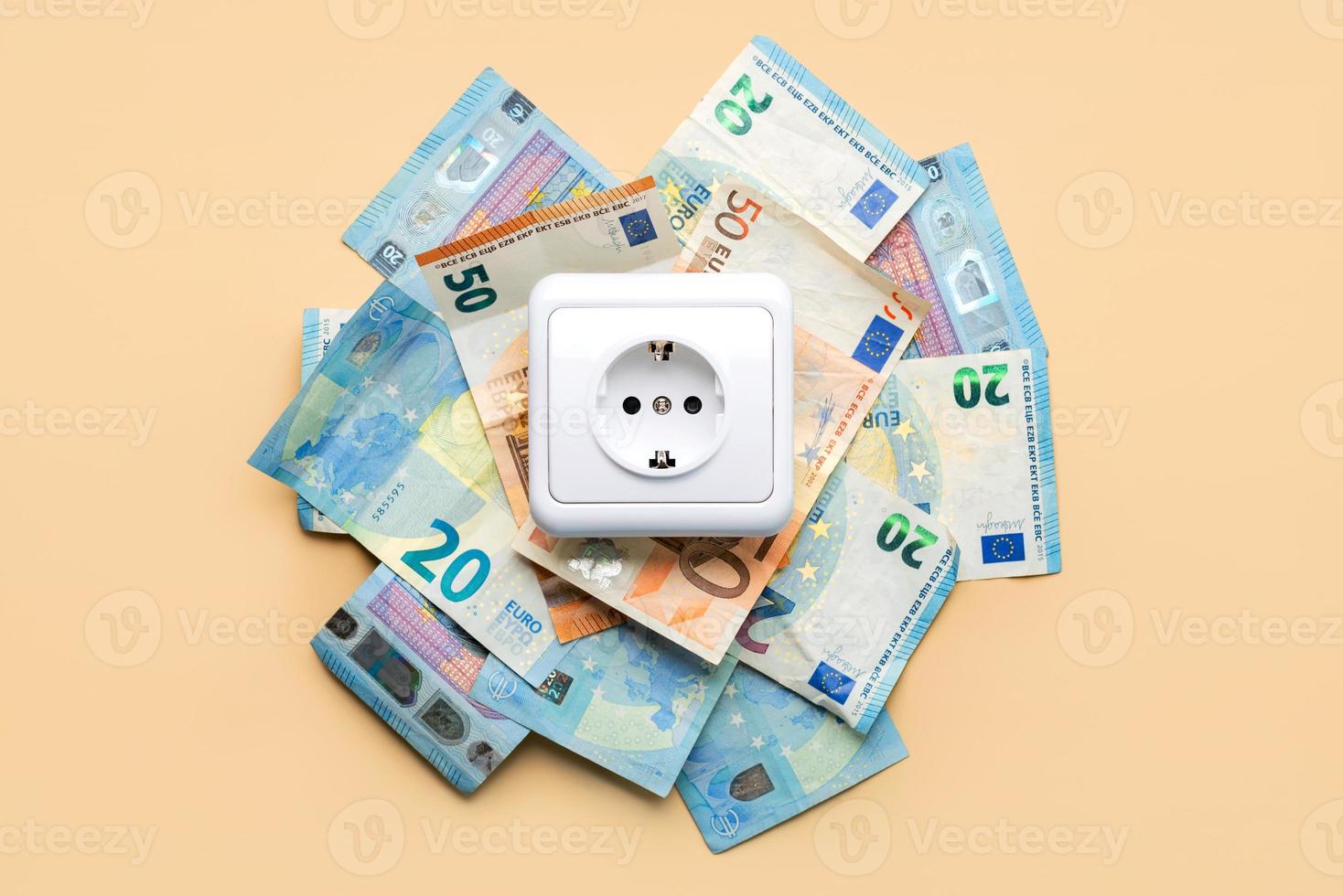 Electricity outlet socket with euro bills photo