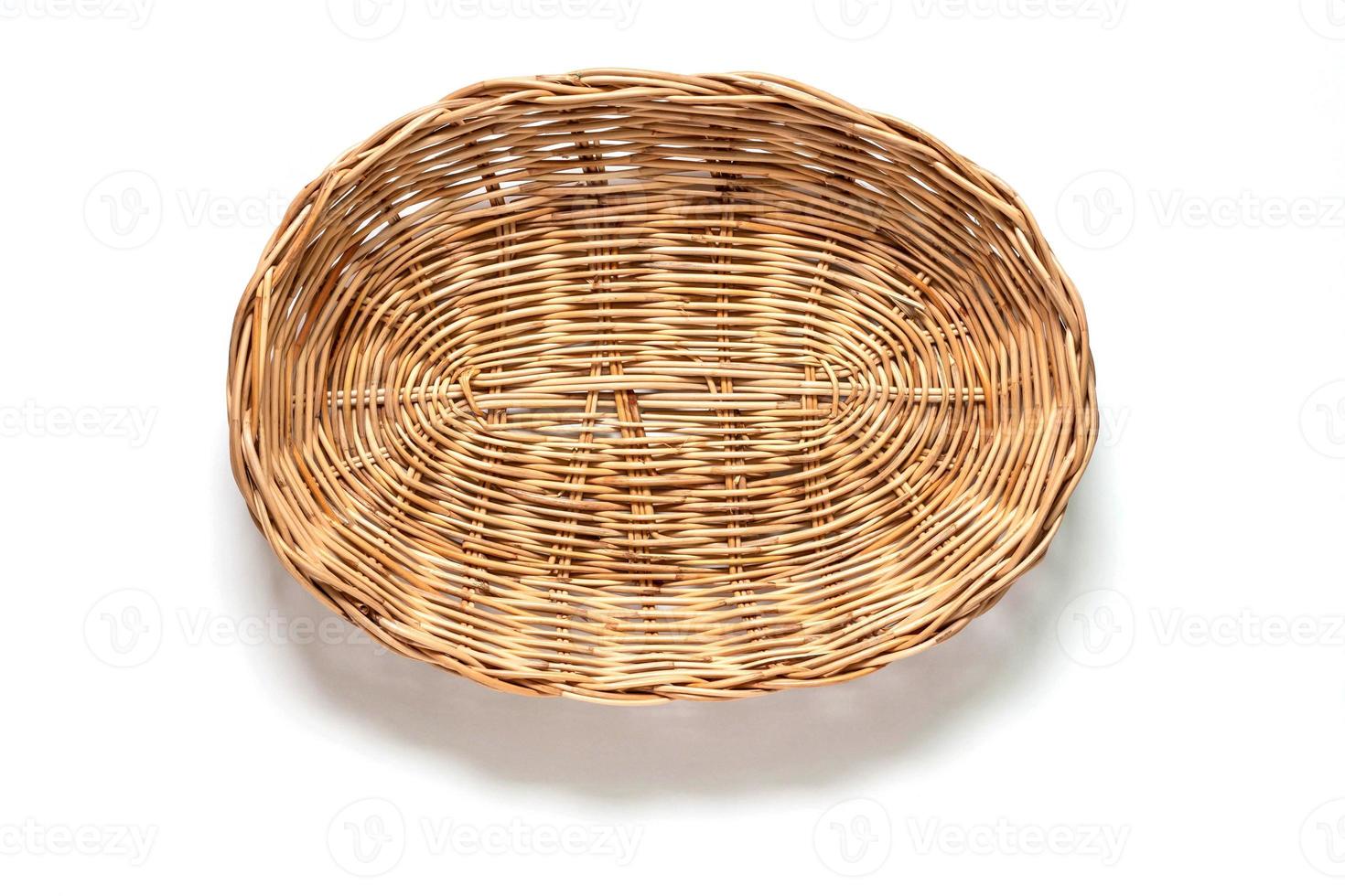 Empty wicker basket on a white background. Top view. photo