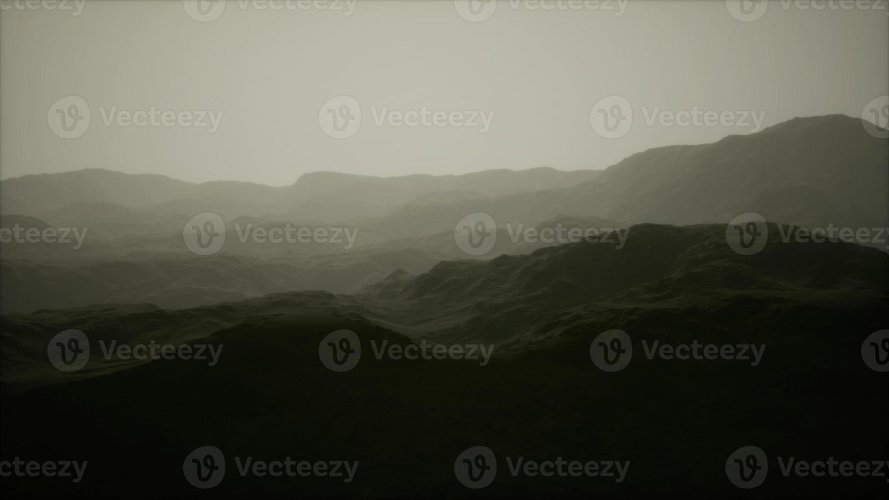 landscape of the Dolomites Mountain Range covered in the fog photo