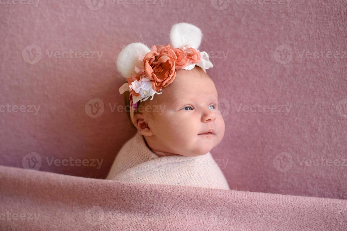 Close-up beautiful sleeping baby girl. Newborn baby girl, asleep on a blanket photo