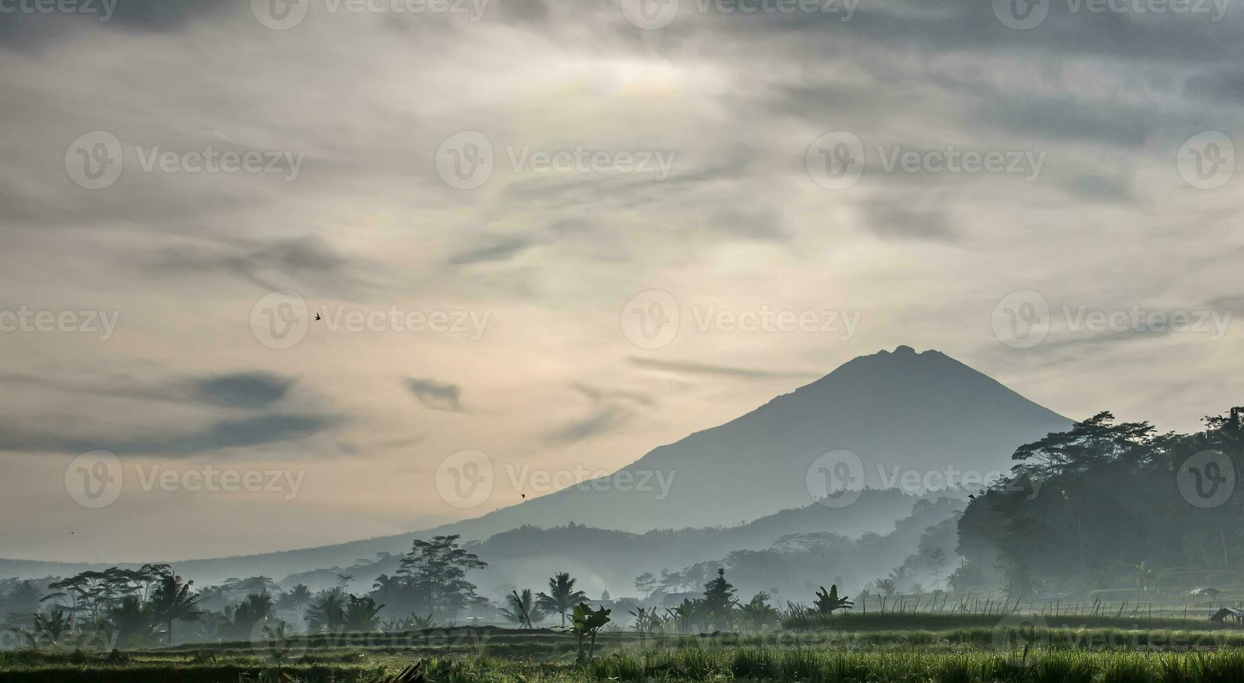 Stunning summer sunrise. Colorful morning scene with the first rays of the sun shining on hills and valleys. Beauty of nature concept background. Post-processed artistic style. photo