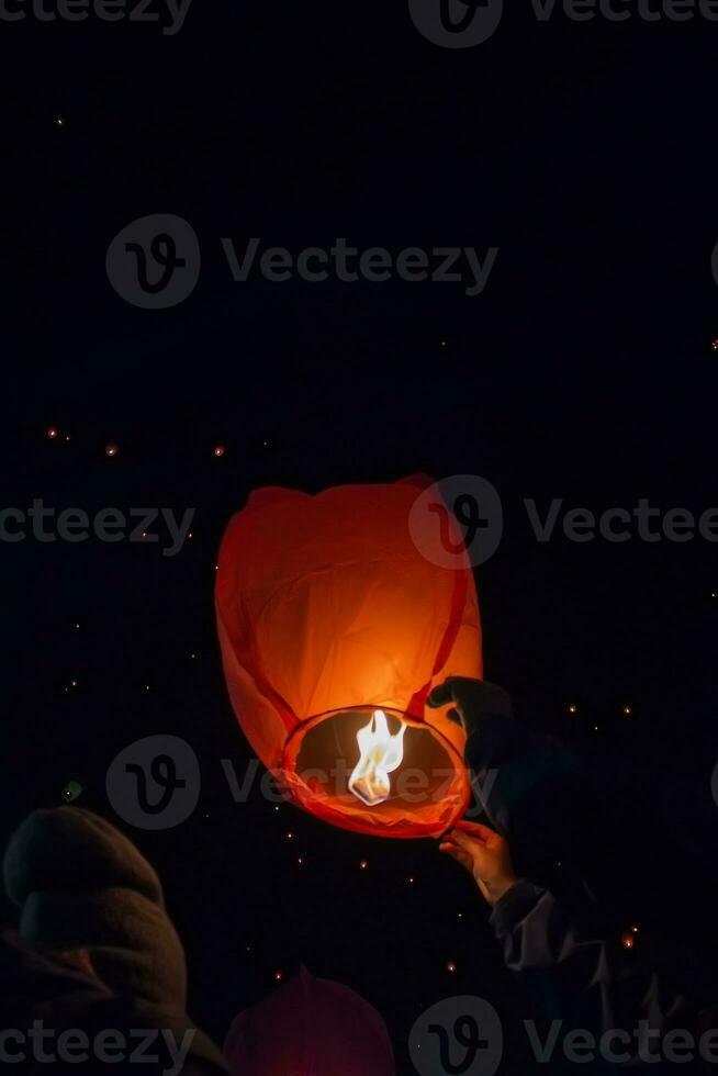 Letting go of the lanterns at night photo