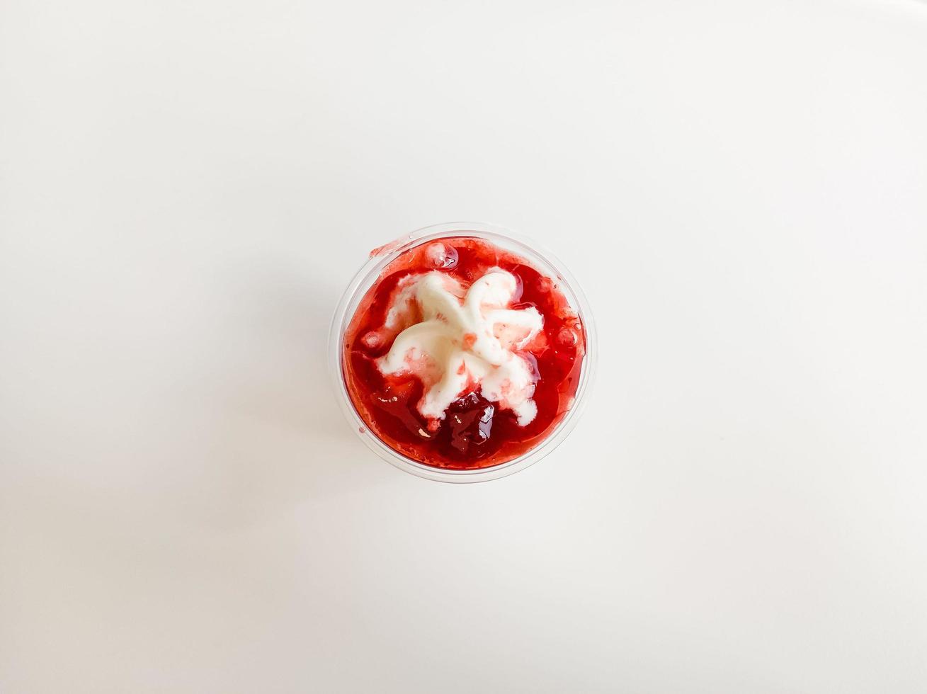 Topping Strawberry Sauce Ice Cream Sundae. photo