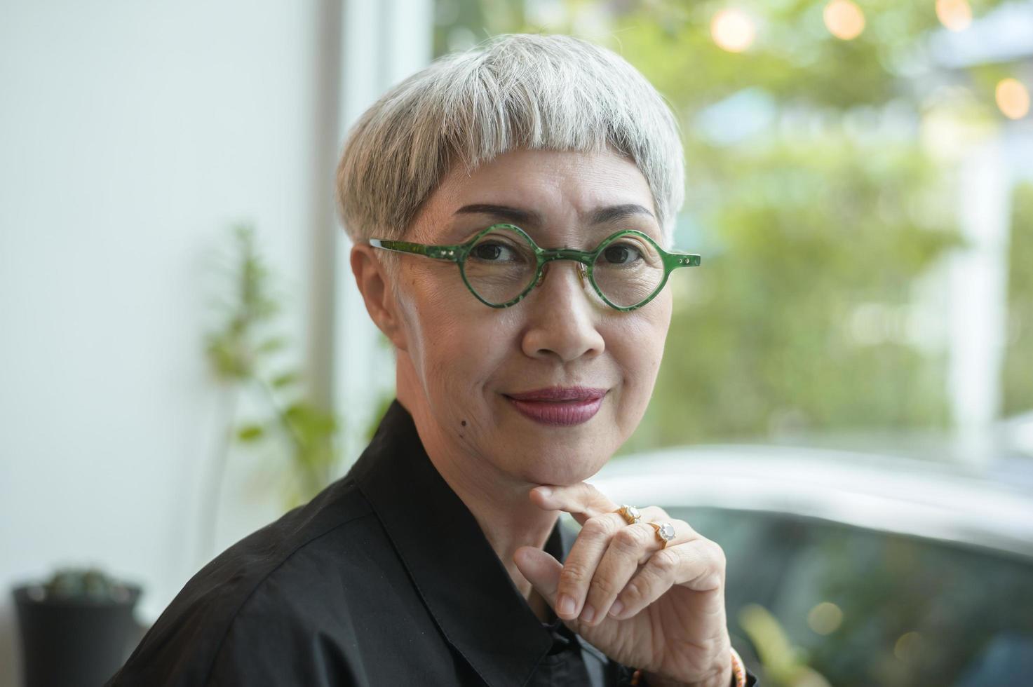 Portrait of senior businesswoman in coffee shop photo