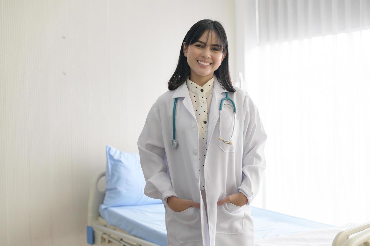 Portrait of young female doctor with stethoscope working at hospital, medical and health care concept photo