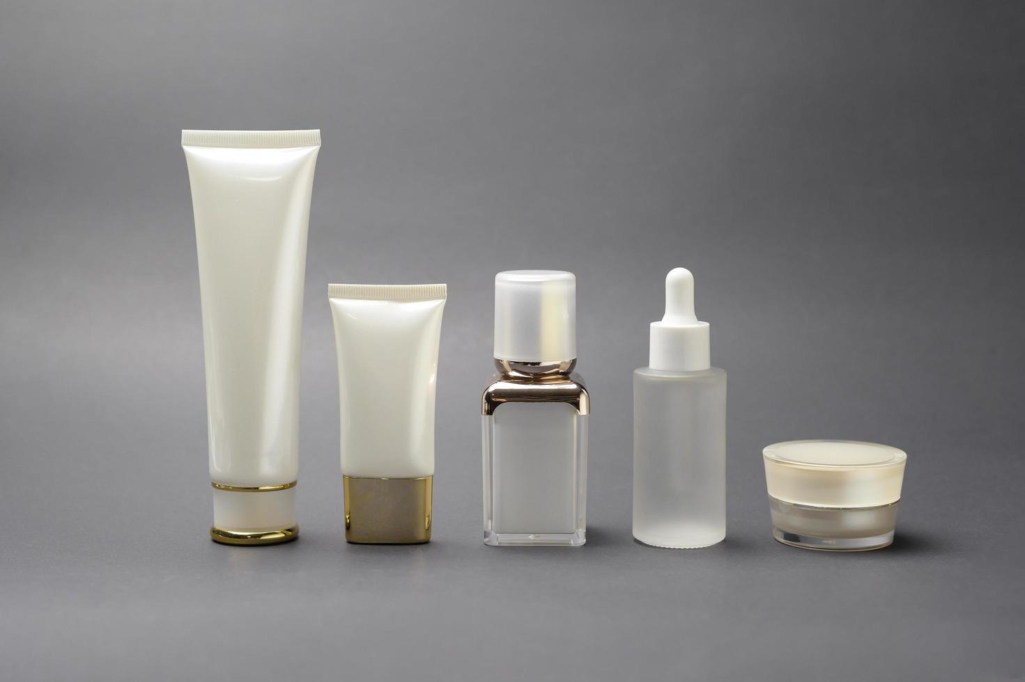 moisturizing cream bottle over black background studio, packing and skincare beauty concept photo