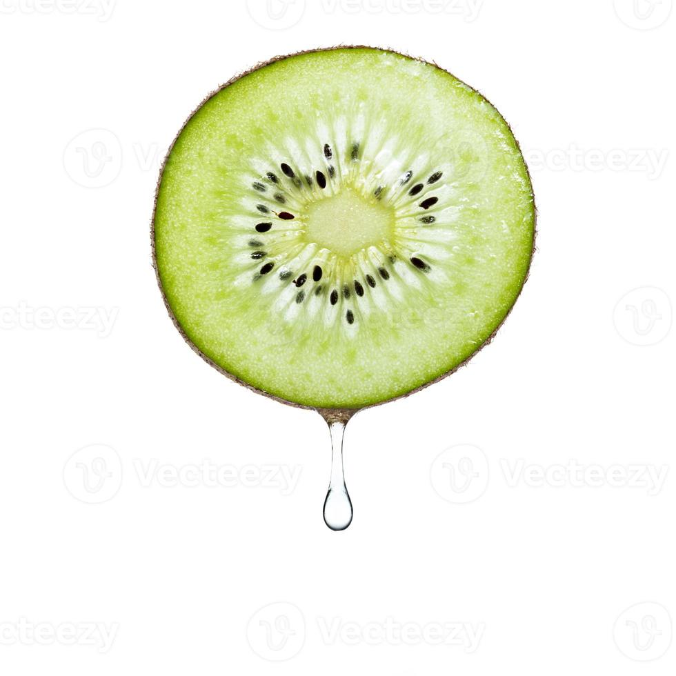 Slice of kiwi fruit wite water drops on white background. photo