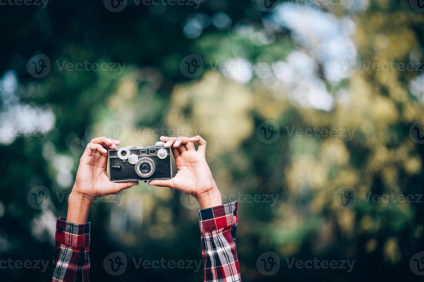 Hand and camera and travel photo