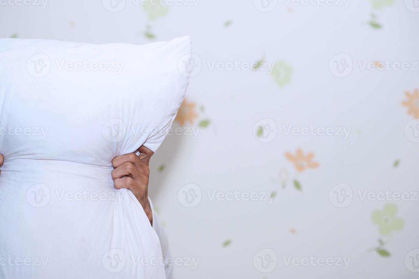 Hands and white pillows photo