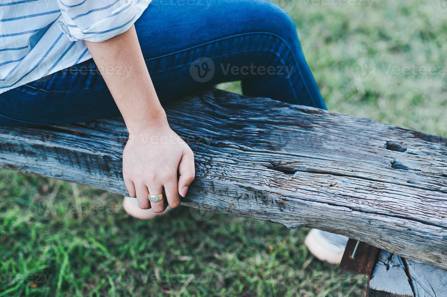 Young girl alone On the wood alone In public areas In good weather Cool wind, most comfortable vacation ideas. photo