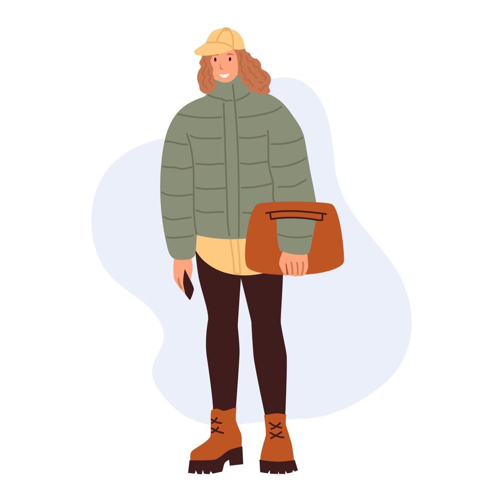 una mujer joven en ropa de invierno. chica de estilo callejero. gente con estilo en ropa de moda. ilustración vectorial plana vector