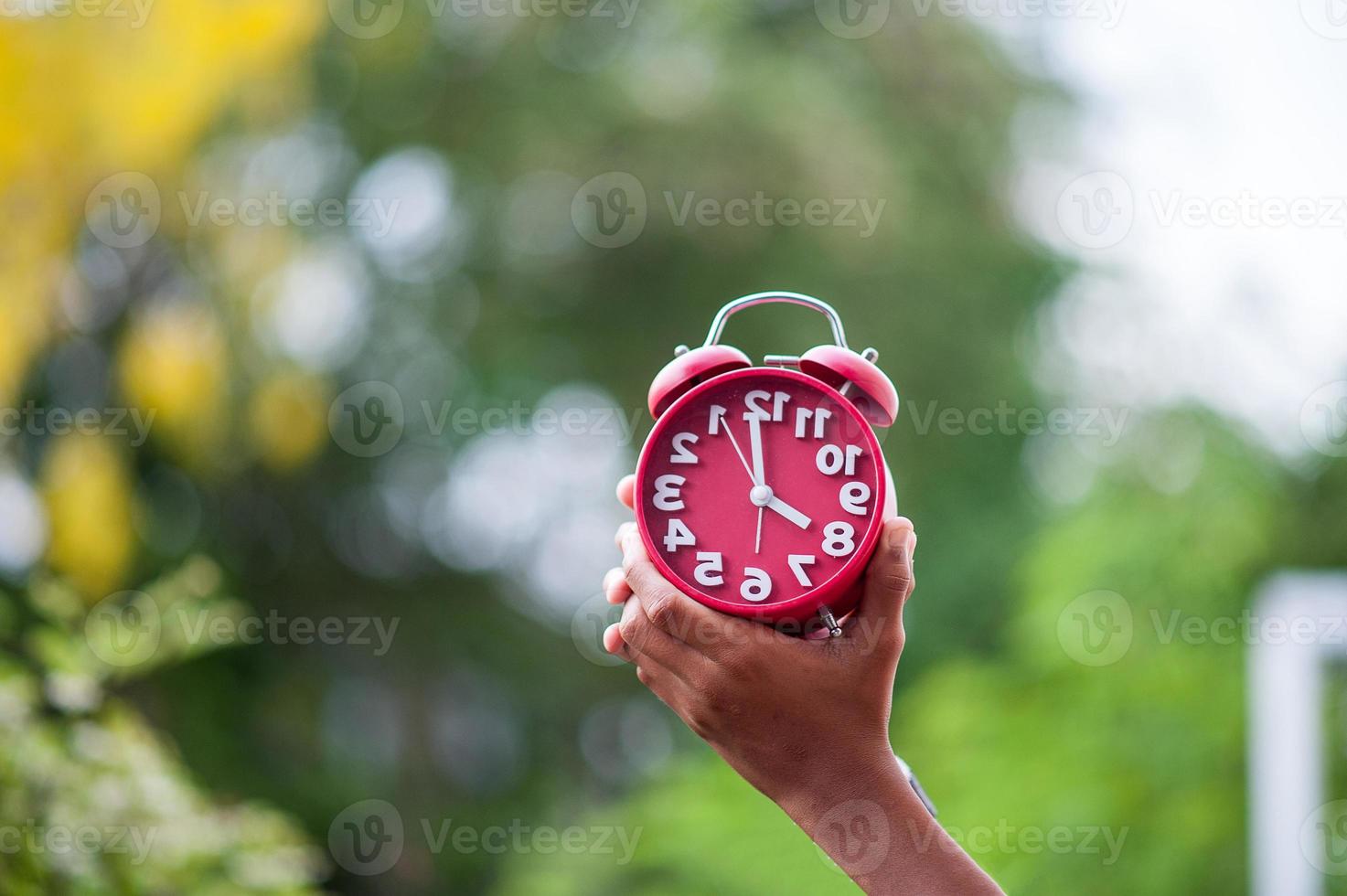 Red clock and hands 6650557 Stock Photo at Vecteezy