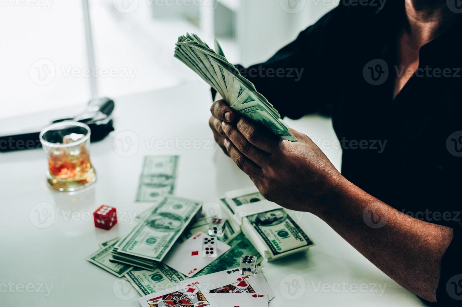 Money and hands of a young businessman. Success in the business. And his money. Put on the desk photo