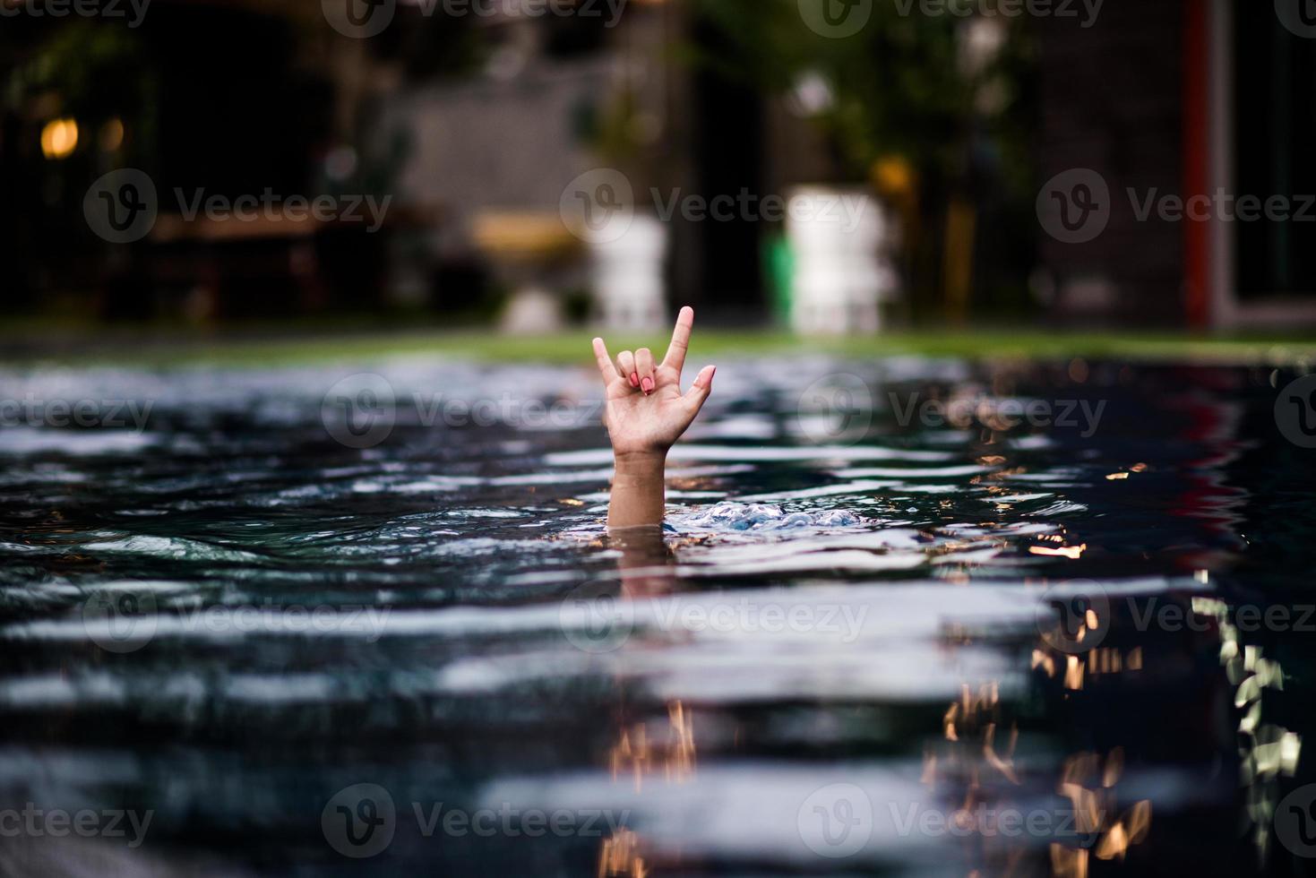 Love hand in the pool. Give it to a loved one. Located on the water side of the pool. photo