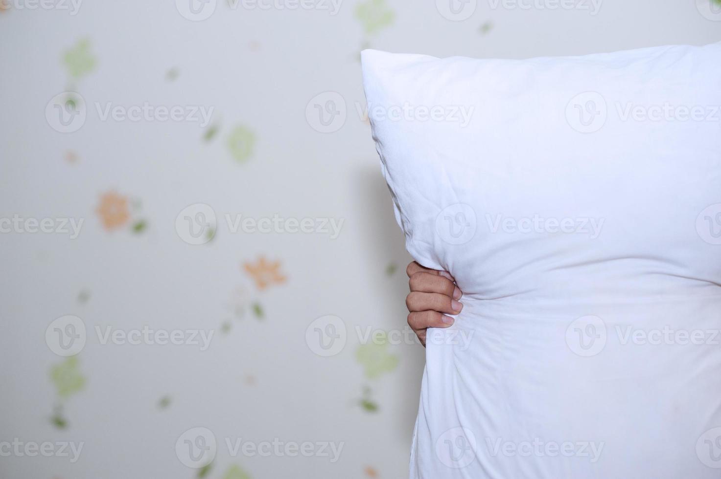 Hands and white pillows photo