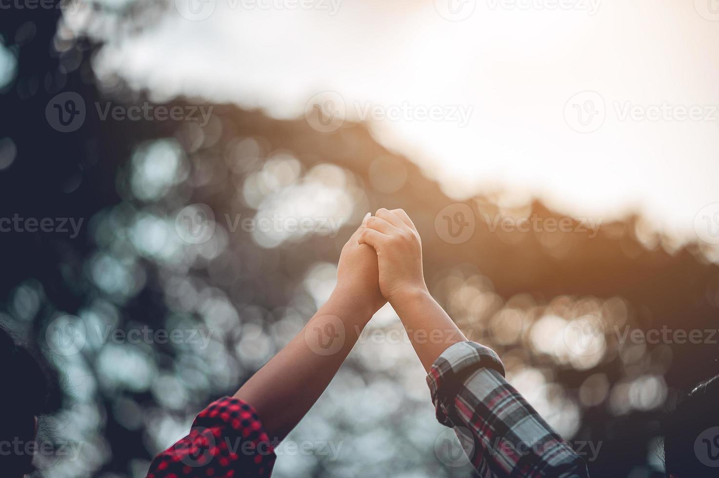 The hands of two people represent unity in work. Successful Business To be a good team photo