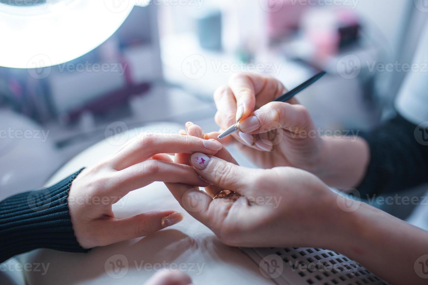 Nail art care progress by proffesional photo