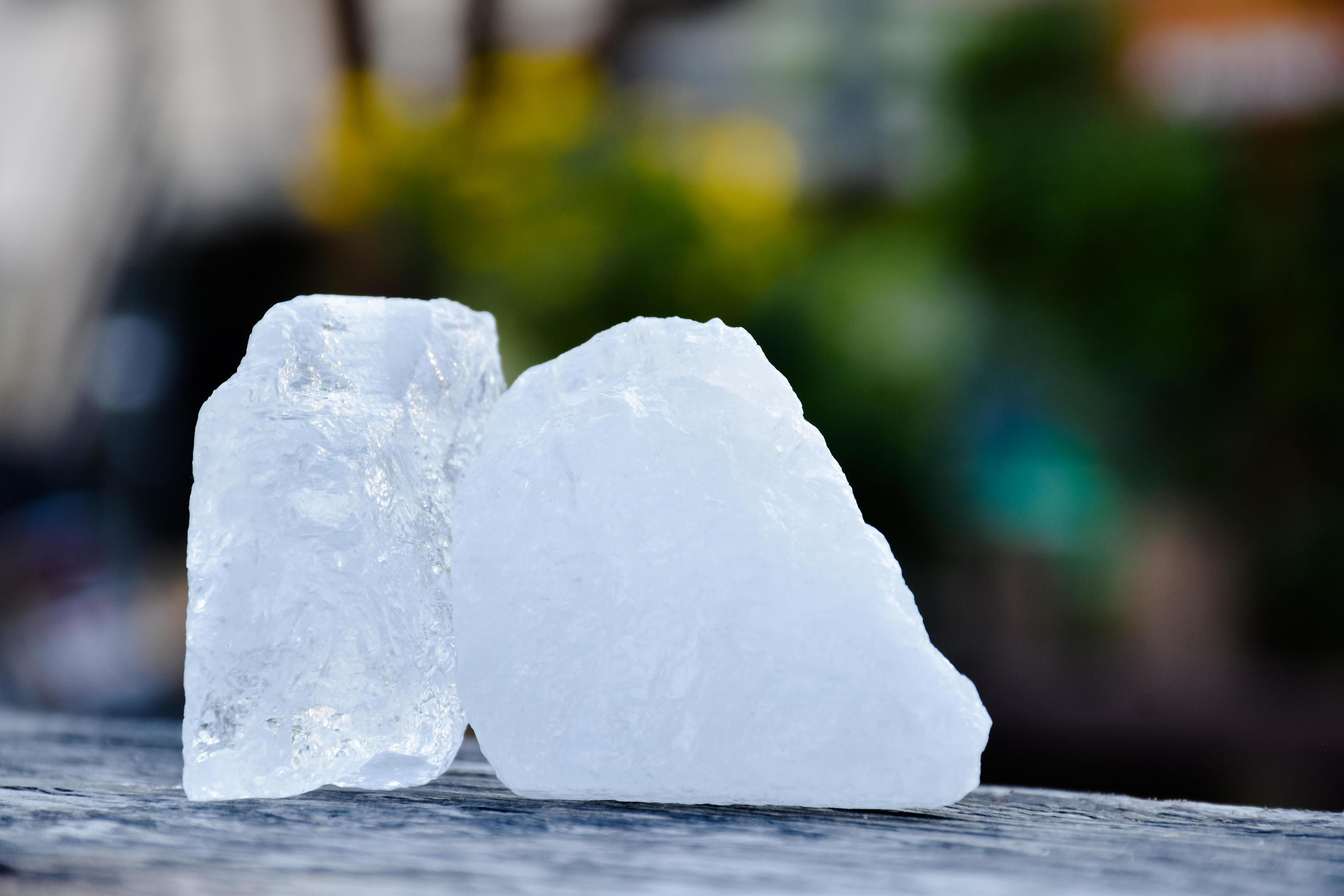 Alum cubes on leaf and wooden table for skincare , waterclear and