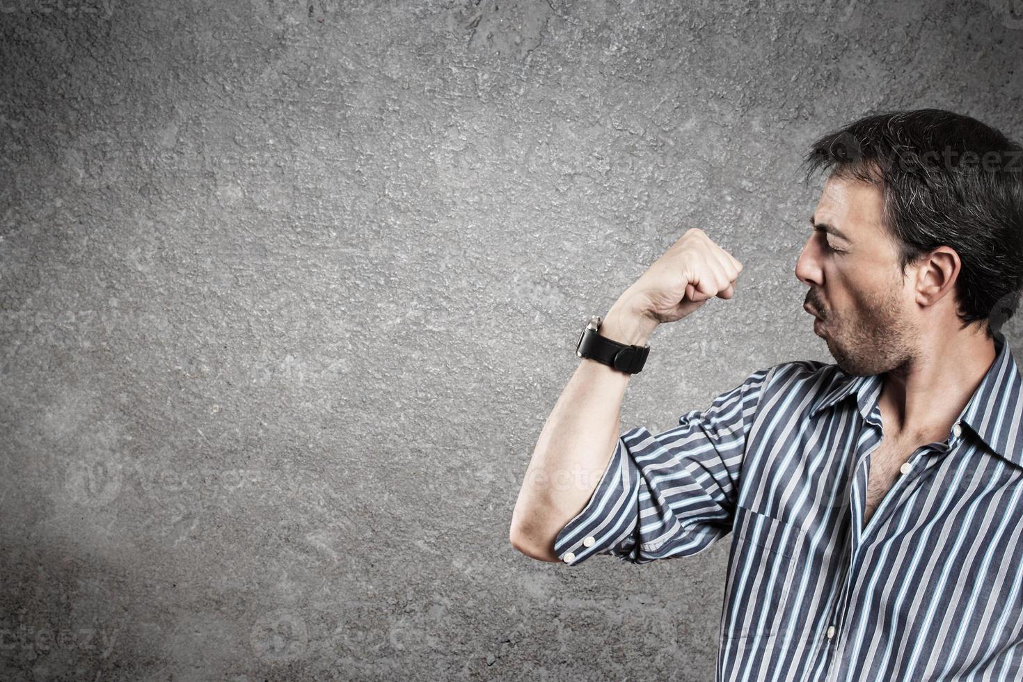 Portrait of successful man raising his fist. Horizontal. photo