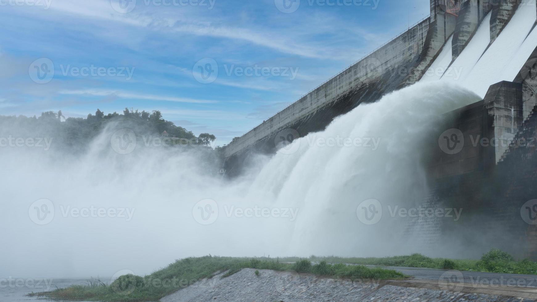 Hydroelectric dam Floodgate with flowing water through gate and Open the springway Khun Dan Prakan Chon Dam in nakhon nayok Thailand photo