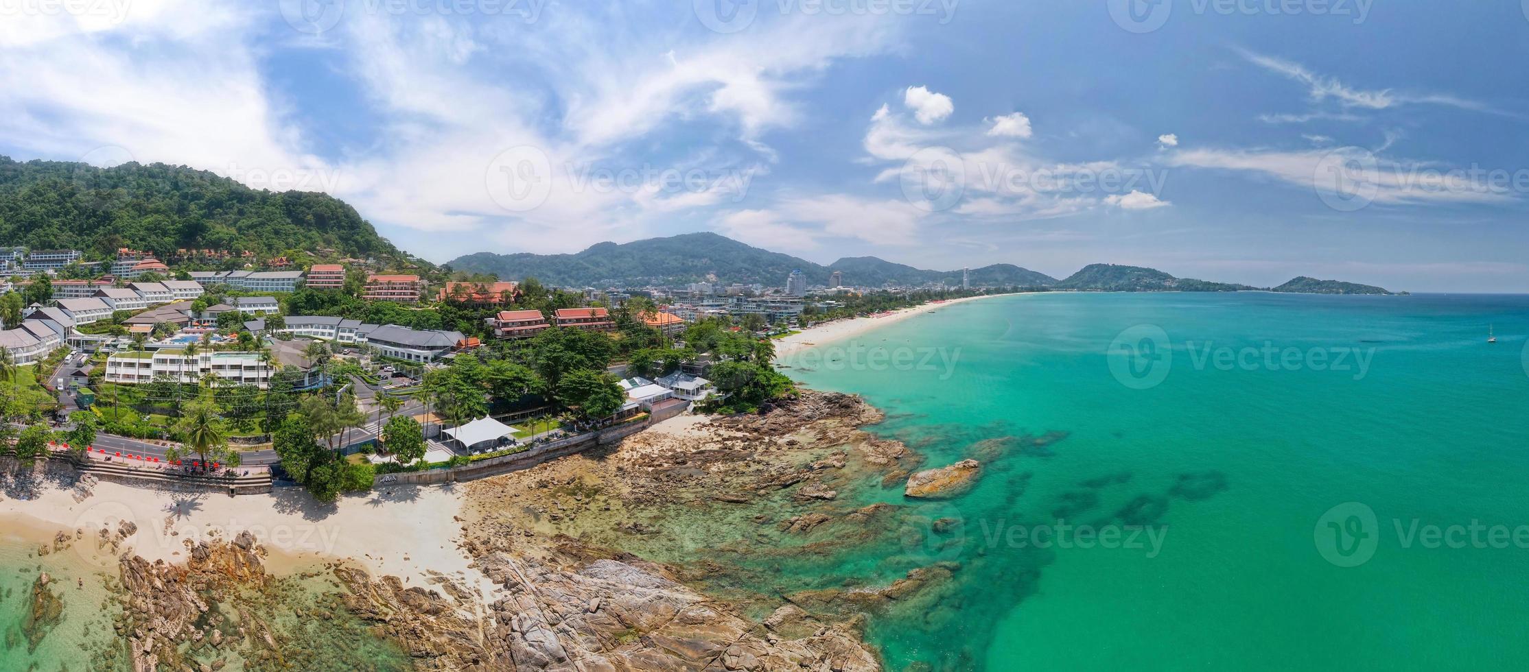 Aerial view panorama image of Patong bay at phuket island. Beautiful island in thailand Amazing High angle view Island seashore with blue sky cloudy sky over sea background Travel holiday Concept photo