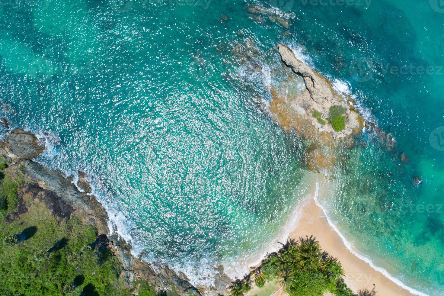 Aerial view Drone camera top view sea beach with coconut palm trees. Beautiful sea phuket island Travel and tour background. Drone camera High angle view photo