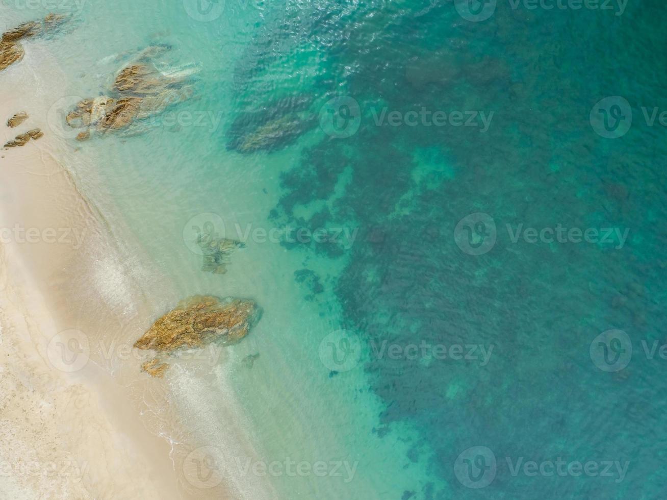 Aerial view sandy beach and waves Beautiful tropical sea in the morning summer season image by Aerial view drone shot High angle view Top down photo