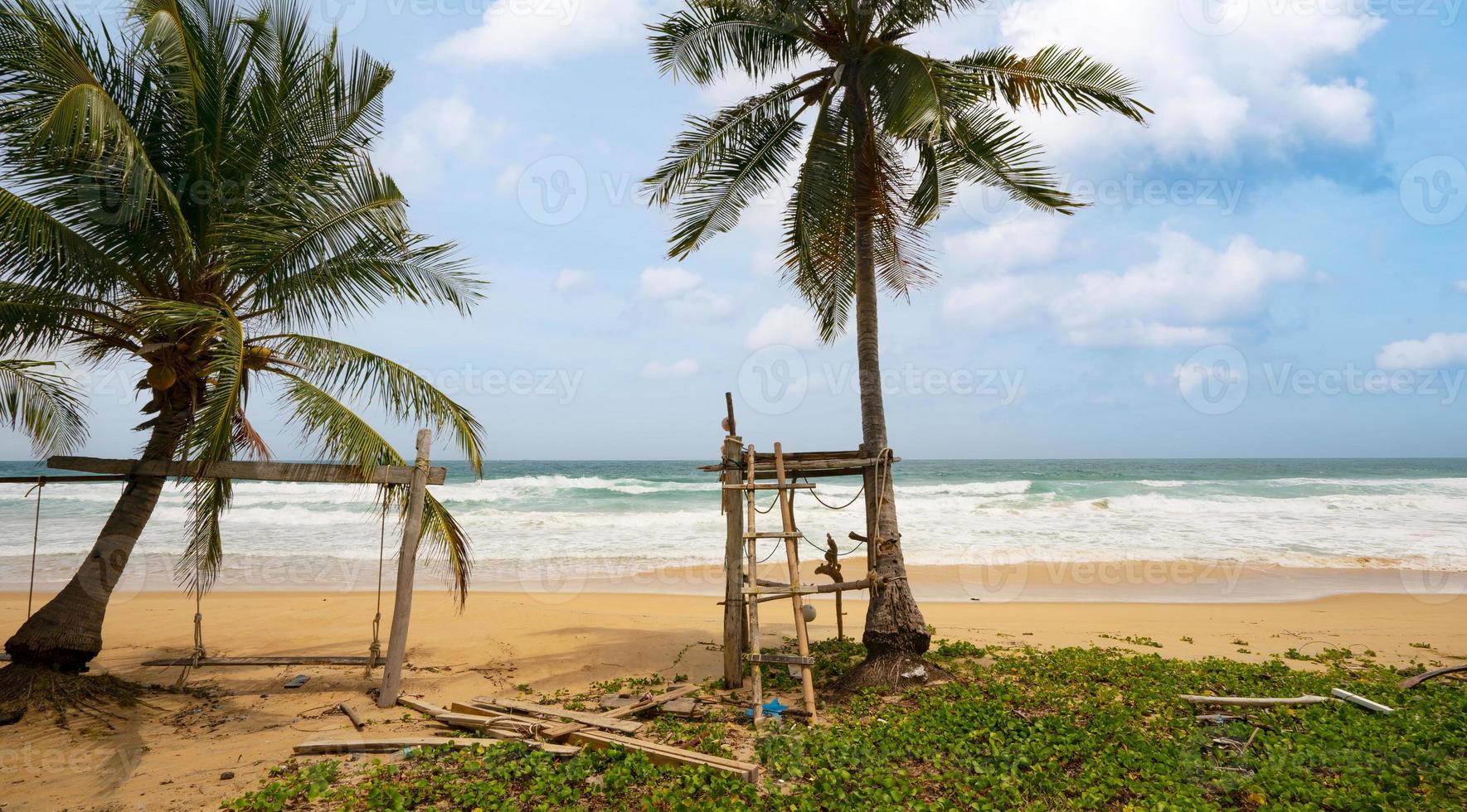 Phuket karon beach Summer beach with palms trees around in Phuket island Thailand, Beautiful tropical beach with blue sky background in summer season Copy space photo