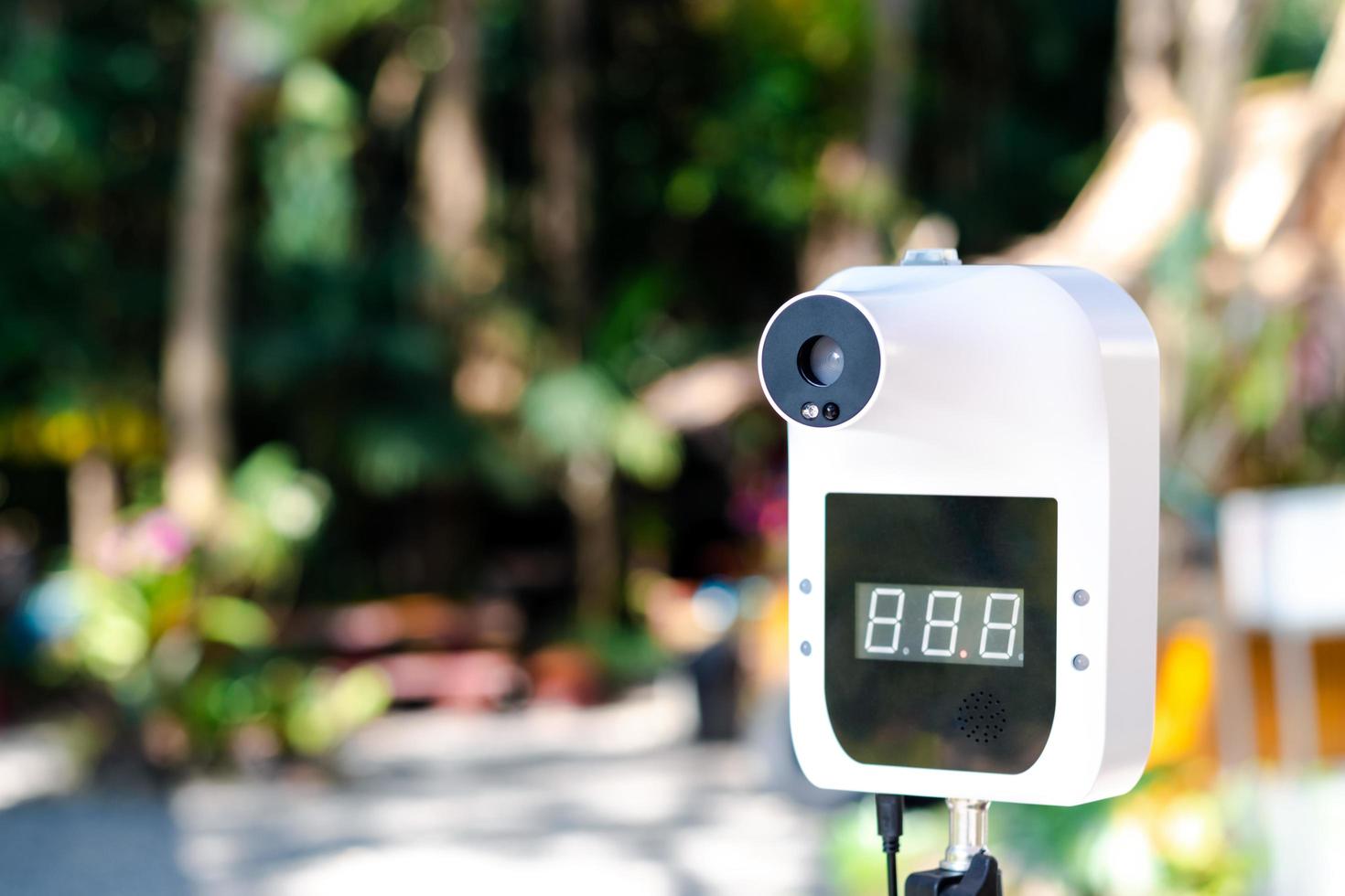 How to prevent the COVID-19 virus, Automatic infrared thermometer at the attraction Used to check the body temperature of tourists. Use this device to check your body temperature faster than normal. photo