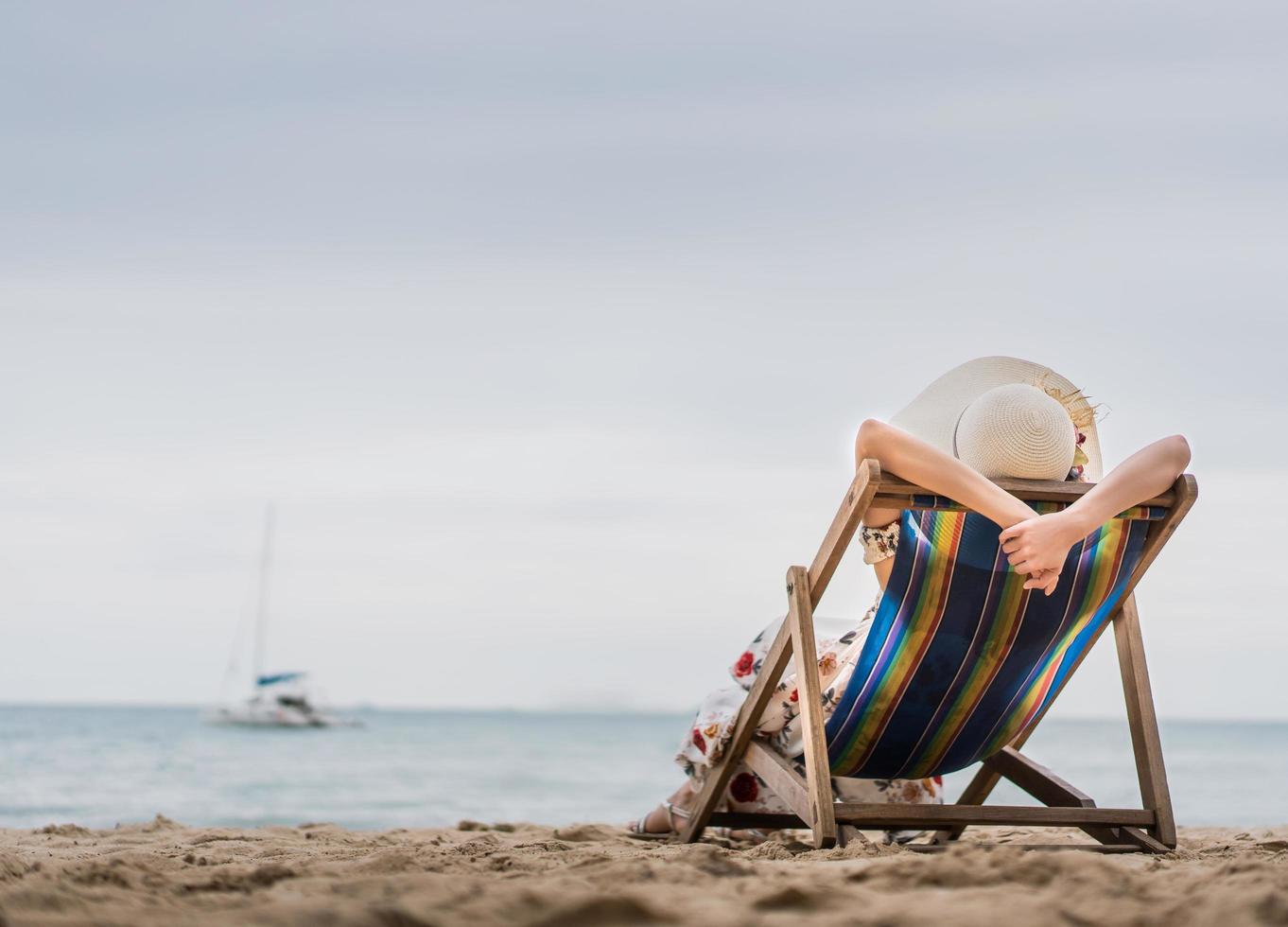 Asia woman relax on beach chair at Pattaya, Thailand photo