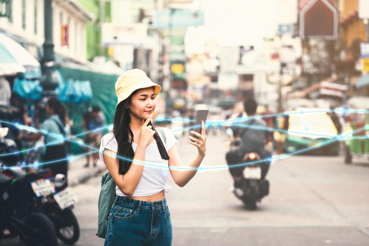 Asian woman using smartphone at Khaosan Road photo