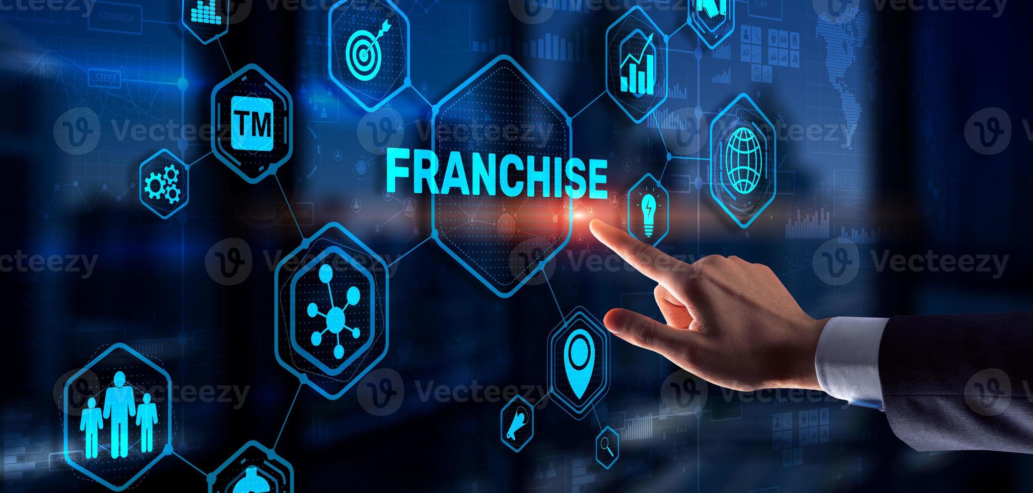 Businessman hand touching inscription Franchise marketing system photo