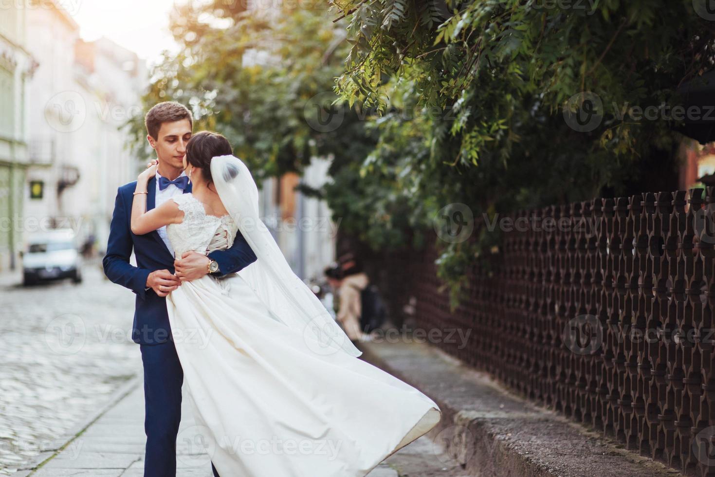 portrait of happy wedding couple outdoors. photo